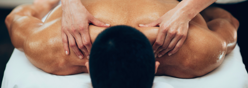 Athlete receiving modern sports massage on a therapy table.